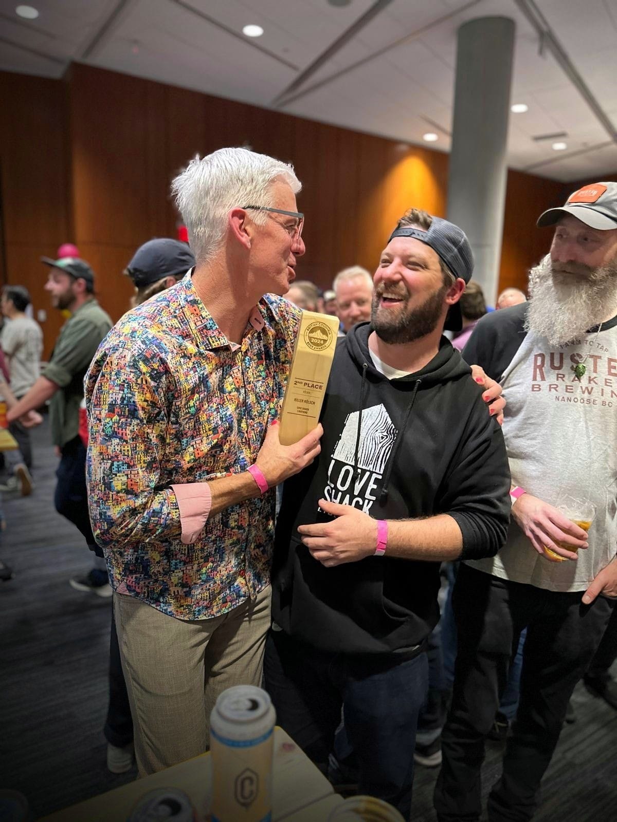 Founder Dave Paul and new owner Jayce Hawkins holding their second place trophy at the 2024 BC Beer Awards